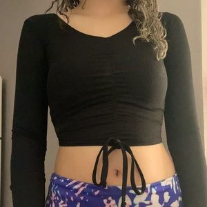 Black cropped long sleeve shirt from boohoo. The size is 4 or small.